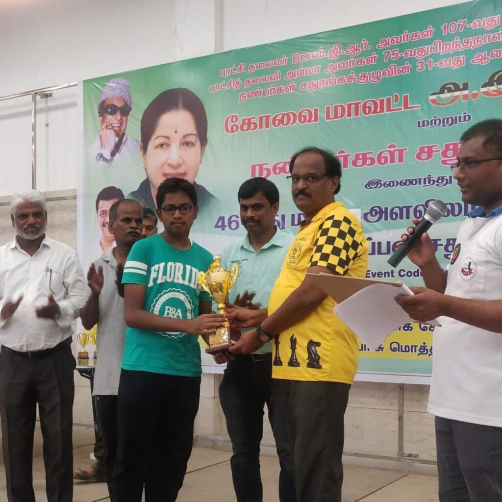 chess academy coimbatore tournament result, student from Coimbatore chess academy holding trophy