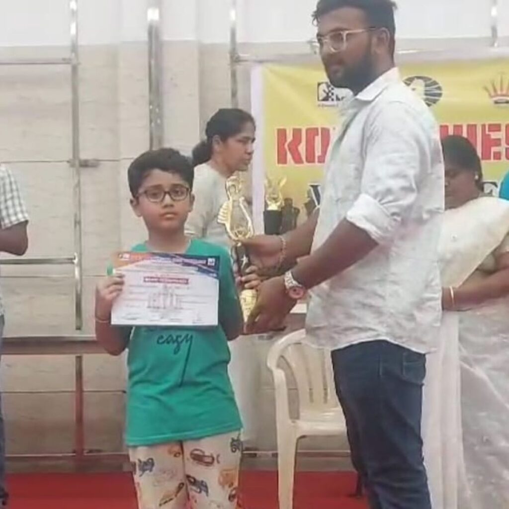 Ishan winning chess prize in Coimbatore district chess tournament