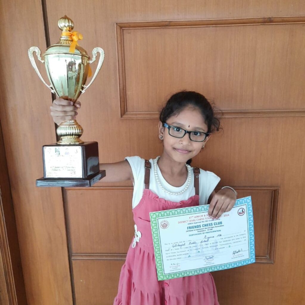 chess training student award moment, chess student holding award after online chess training in Coimbatore