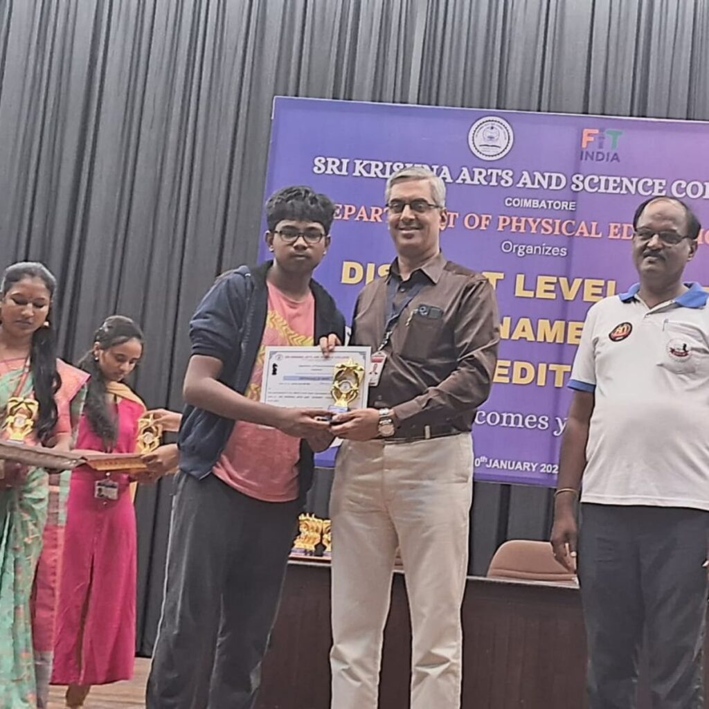 coimbatore chess tournament student result Coimbatore chess student holding trophy