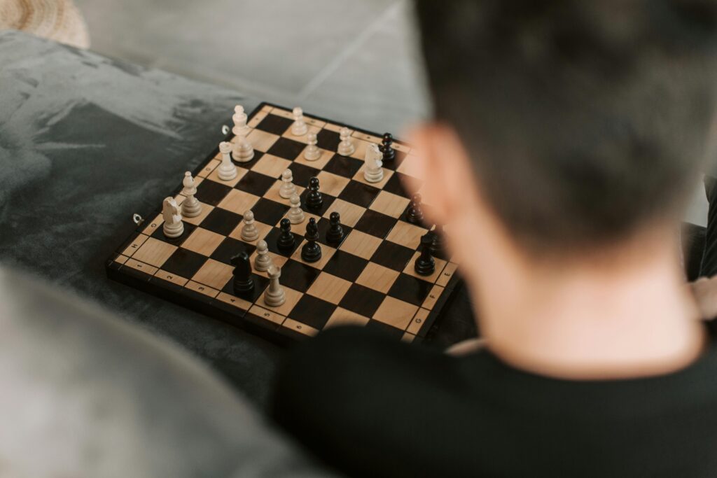 child solving chess puzzle